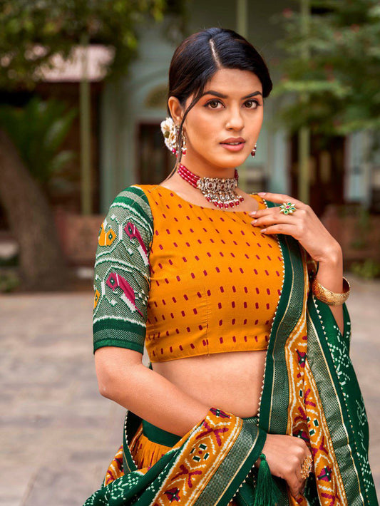 Shop Orange Ikat Patola Lehenga Set Online | Vaanya Kurtis