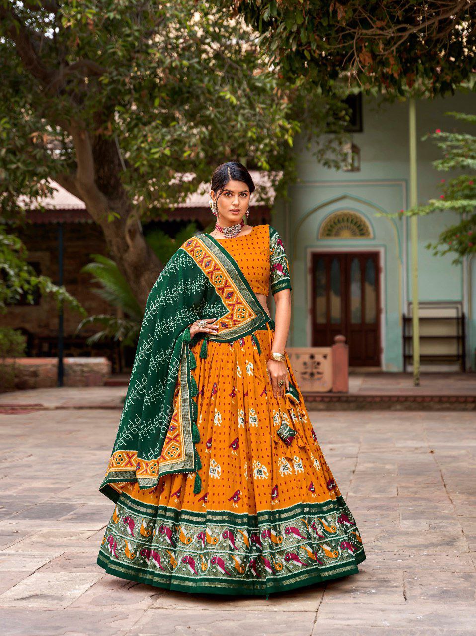 Shop Orange Ikat Patola Lehenga Set Online | Vaanya Kurtis